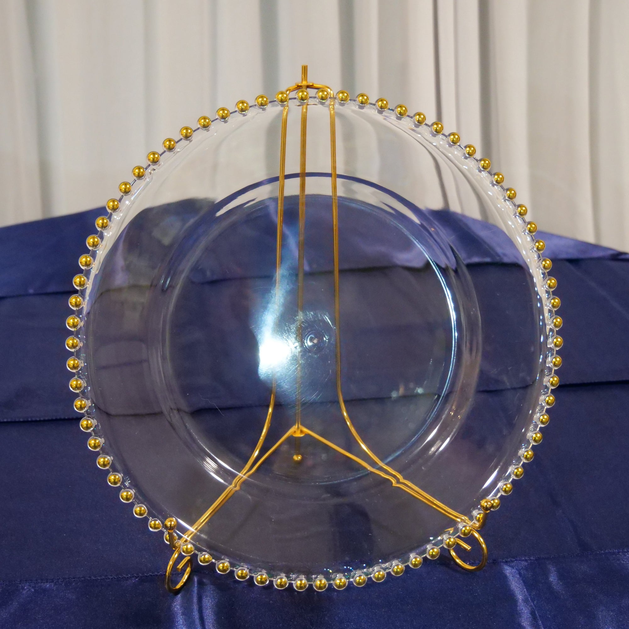 Location - Grand plat rond porte assiette transparent bords dorés